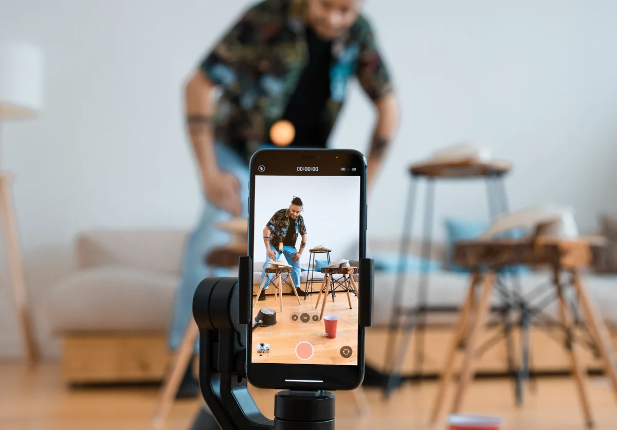 Influencer content creator filming authentic TikTok video for social SEO and user-generated content marketing
